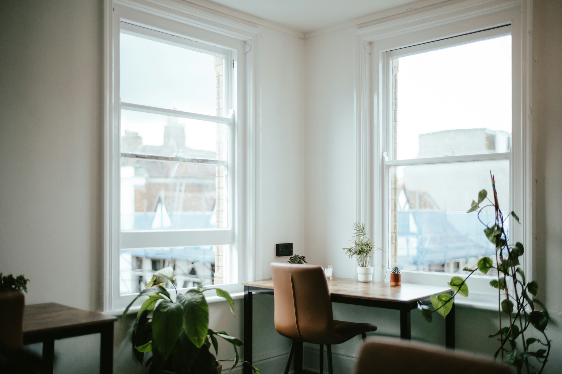 A quiet desk by a tall window
